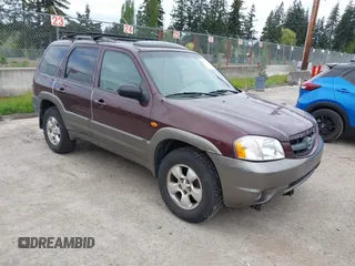 2001 Mazda Tribute LX with VIN 4F2CU08141KM10269, listed as a IAAI auction lot 42138704 with 166,825 mi miles and . Bid and sale history available at carsss.com. Image 1.