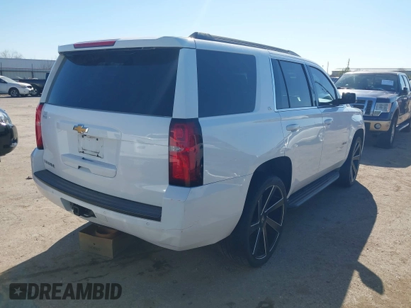 2015 Chevrolet Tahoe LS with VIN 1GNSCAKCXFR748554, listed as a IAAI auction lot 41765865 with 160,282 mi miles and . Bid and sale history available at DreamBid. Image 4.