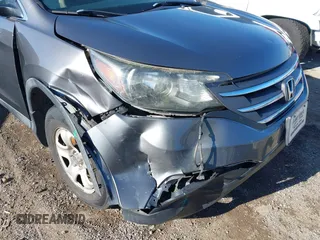 2014 Honda CR-V LX with VIN 2HKRM4H39EH634676, listed as a IAAI auction lot 41233279 with 153,761 mi miles and . Bid and sale history available at carsss.com. Image 6.