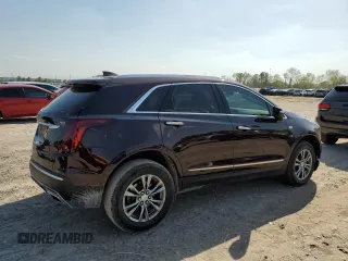 2021 Cadillac XT5 FWD Premium Luxury with VIN 1GYKNCRS2MZ180884, listed as a Copart auction lot 50433445 with 27,246 mi miles and Salvage Title. Bid and sale history available at carsss.com. Image 3.