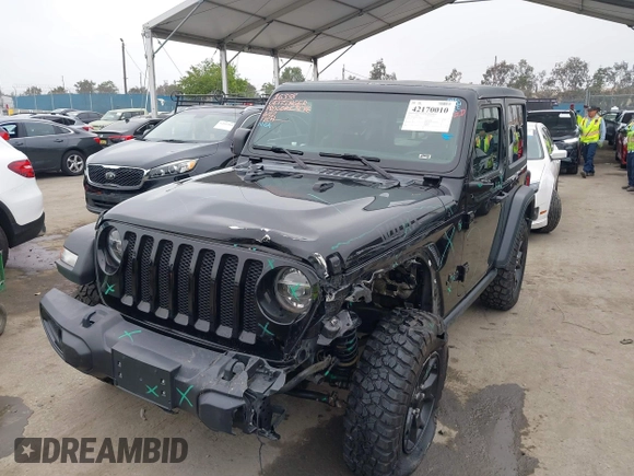 2021 Jeep Wrangler Sport with VIN 1C4GJXAN5MW627228, listed as a IAAI auction lot 42170010 with 56,965 mi miles and . Bid and sale history available at DreamBid. Image 2.