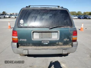 1995 Jeep Grand Cherokee Laredo with VIN 1J4FX58S5SC741328, listed as a Copart auction lot 82034594 with 260,398 mi miles and Clean Title. Bid and sale history available at carsss.com. Image 6.