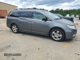 2012 Honda Odyssey Touring with VIN 5FNRL5H90CB050580, listed as a Copart auction lot 58502925 with 226,929 mi miles and Salvage title. Bid and sale history available at DreamBid. Image 4.