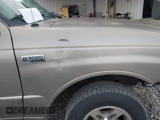 2003 Mazda B-Series 2WD Truck SE with VIN 4F4YR46VX3TM16294, listed as a IAAI auction lot 42034107 with 165,007 mi miles. Bid and sale history available at carsss.com. Image 13.