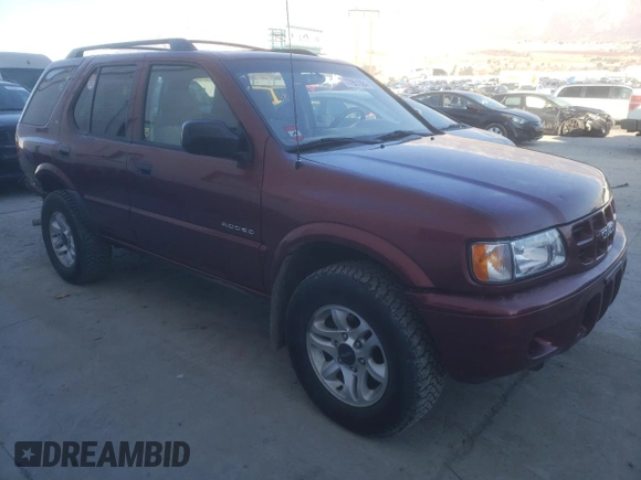 2002 Isuzu Rodeo S with VIN 4S2DM58W824313096, listed as a Copart auction lot 77951364 with 127,470 mi miles and Salvage Title. Bid and sale history available at DreamBid. Image 4.