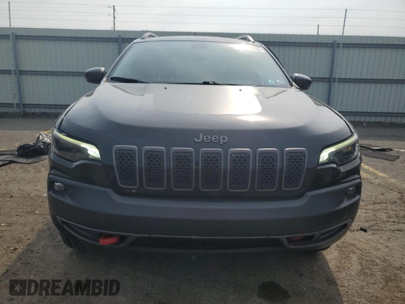 2019 Jeep Cherokee Trailhawk z VIN 1C4PJMBXXKD471338, wystawiony jako Copart lot #59880765 z przebiegiem 59 546 mil mil oraz Szkoda całkowita • Salvage title. Historia ofert i sprzedaży dostępna na DreamBid. Obrazek 5.