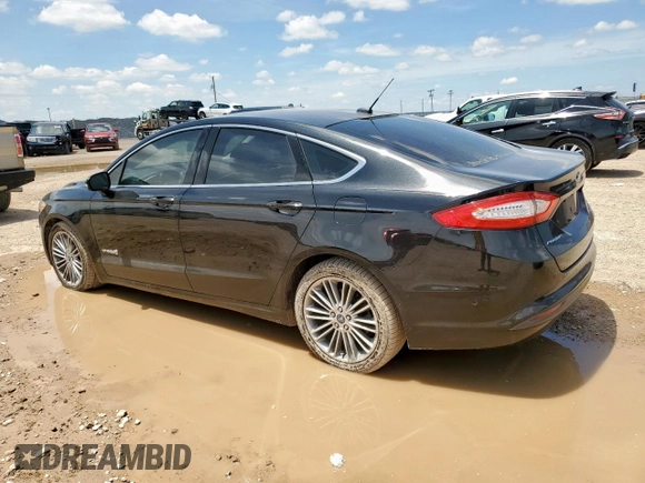 2013 Ford Fusion SE Hybrid with VIN 3FA6P0LU0DR267560, listed as a Copart auction lot 60563415 with 140,998 mi miles and Clean title. Bid and sale history available at DreamBid. Image 2.