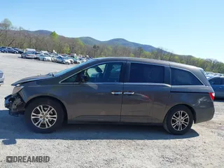 2011 Honda Odyssey EX-L with VIN 5FNRL5H60BB072101, listed as a IAAI auction lot 42002097 with 243,607 mi miles. Bid and sale history available at carsss.com. Image 14.