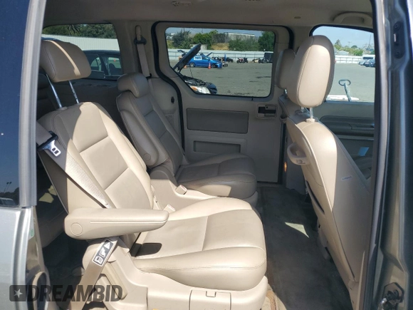 2004 Ford Freestar SEL z VIN 2FMDA522X4BA41942, wystawiony jako Copart lot #54007555 z przebiegiem 119 877 mil mil oraz Szkoda całkowita • Salvage title. Historia ofert i sprzedaży dostępna na DreamBid. Obrazek 11.