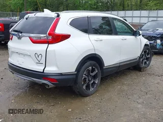 2018 Honda CR-V Touring z VIN 5J6RW1H96JL014087, wystawiony jako IAAI lot #41931640 z przebiegiem Nie podano mil oraz . Historia ofert i sprzedaży dostępna na DreamBid. Obrazek 4.