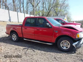 2003 Ford F-150 XLT with VIN 1FTRW07L13KD81923, listed as a IAAI auction lot 42112168 with 147,039 mi miles. Bid and sale history available at carsss.com. Image 14.
