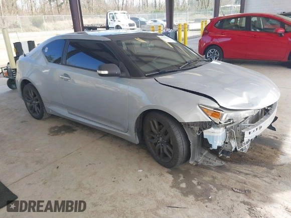 2014 Scion tC with VIN JTKJF5C71E3069593, listed as a IAAI auction lot 41901040 with 86,231 mi miles. Bid and sale history available at carsss.com. Image 1.
