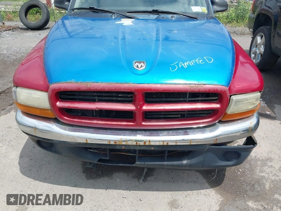 2001 Dodge Dakota Sport z VIN 1B7GL2AN31S115001, wystawiony jako IAAI lot #42452634 z przebiegiem Nie podano mil oraz . Historia ofert i sprzedaży dostępna na DreamBid. Obrazek 6.