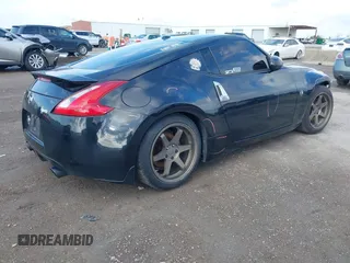 2015 Nissan 370Z Sport with VIN JN1AZ4EH8FM443095, listed as a IAAI auction lot 41105775 with 135,354 mi miles. Bid and sale history available at carsss.com. Image 4.