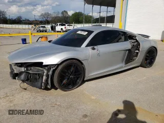 2012 Audi R8 V10 with VIN WUAENAFG0CN000740, listed as a Copart auction lot 47002395 with 60,873 mi miles and Salvage Title. Bid and sale history available at DreamBid. Image 1.