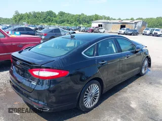 2016 Ford Fusion Titanium z VIN 3FA6P0K97GR174228, wystawiony jako IAAI lot #42636326 z przebiegiem 110 288 mil mil oraz . Historia ofert i sprzedaży dostępna na DreamBid. Obrazek 4.