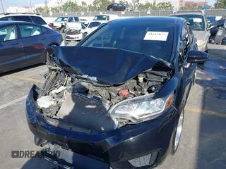 2015 Honda Fit LX z VIN 3HGGK5H57FM717203, wystawiony jako IAAI lot #41615075 z przebiegiem 99 933 mil mil oraz . Historia ofert i sprzedaży dostępna na DreamBid. Obrazek 6.