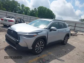 2023 Toyota Corolla Cross XLE with VIN 7MUDAAAG0PV057750, listed as a IAAI auction lot 42302284 with 31,404 mi miles and . Bid and sale history available at DreamBid. Image 2.