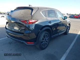 2018 Mazda CX-5 Grand Touring with VIN JM3KFBDM1J0345014, listed as a IAAI auction lot 42703926 with 151,453 mi miles and . Bid and sale history available at DreamBid. Image 4.