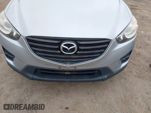 2016 Mazda CX-5 Sport z VIN JM3KE4BY1G0711602, wystawiony jako IAAI lot #42537627 z przebiegiem Nie podano mil oraz . Historia ofert i sprzedaży dostępna na DreamBid. Obrazek 6.