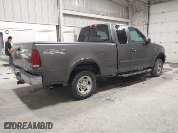 2002 Ford F-150 XL with VIN 1FTRX18W92KA81797, listed as a IAAI auction lot 42250147 with 162,918 mi miles and . Bid and sale history available at DreamBid. Image 4.