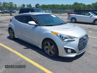 2014 Hyundai Veloster Turbo with VIN KMHTC6AE6EU192473, listed as a IAAI auction lot 42601163 with 156,732 mi miles and . Bid and sale history available at DreamBid. Image 1.