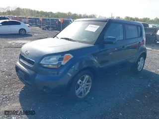 2011 Kia Soul + with VIN KNDJT2A28B7232900, listed as a IAAI auction lot 42093207 with 153,504 mi miles. Bid and sale history available at carsss.com. Image 2.