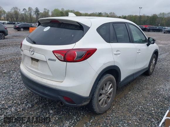 2015 Mazda CX-5 Touring with VIN JM3KE2CY4F0436664, listed as a IAAI auction lot 41876238 with 374,305 mi miles. Bid and sale history available at carsss.com. Image 4.