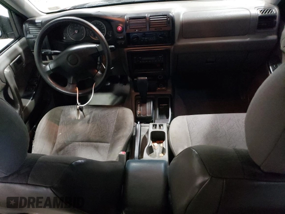 2004 Isuzu Rodeo S z VIN 4S2CK58W144306785, wystawiony jako Copart lot #85124684 z przebiegiem 296 433 mil mil oraz Szkody całkowita. Historia ofert i sprzedaży dostępna na DreamBid. Obrazek 8.