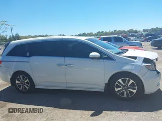 2015 Honda Odyssey Touring Elite with VIN 5FNRL5H96FB090702, listed as a IAAI auction lot 41825889 with 118,157 mi miles and . Bid and sale history available at DreamBid. Image 14.