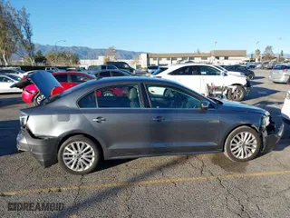 2015 Volkswagen Jetta Sedan 1.8T Sport with VIN 3VWD17AJ2FM318669, listed as a IAAI auction lot 41266868 with 124,539 mi miles. Bid and sale history available at carsss.com. Image 13.