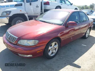 2001 Cadillac Catera z VIN W06VR54R01R003061, wystawiony jako IAAI lot #41989882 z przebiegiem 77 248 mil mil oraz . Historia ofert i sprzedaży dostępna na DreamBid. Obrazek 2.