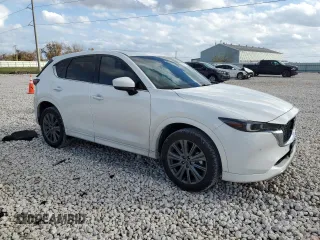 2024 Mazda CX-5 2.5 Turbo Signature with VIN JM3KFBXY7R0518304, listed as a Copart auction lot 42788985 with 8,593 mi miles and Salvage Title. Bid and sale history available at carsss.com. Image 4.
