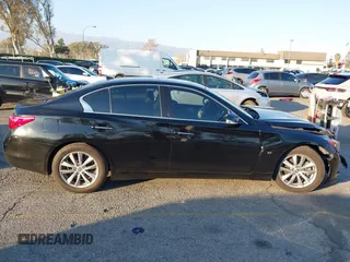 2015 Infiniti Q50 Premium z VIN JN1BV7AP5FM346323, wystawiony jako IAAI lot #41305093 z przebiegiem 112 556 mil mil oraz . Historia ofert i sprzedaży dostępna na DreamBid. Obrazek 13.