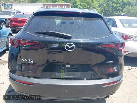 2022 Mazda CX-30 S Carbon Edition with VIN 3MVDMBCL3NM440188, listed as a IAAI auction lot 42259723 with 48,555 mi miles and . Bid and sale history available at DreamBid. Image 17.