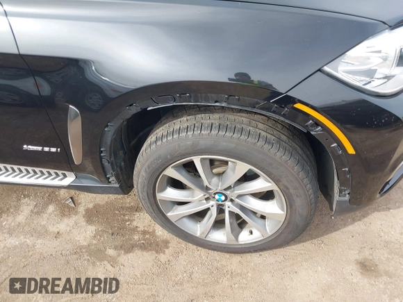 2015 BMW X6 xDrive35i z VIN 5UXKU2C56F0F95429, wystawiony jako IAAI lot #41754635 z przebiegiem 79 503 mil mil oraz . Historia ofert i sprzedaży dostępna na DreamBid. Obrazek 6.
