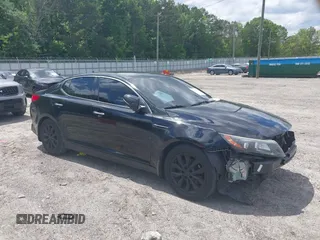 2015 Kia Optima EX z VIN 5XXGN4A74FG392684, wystawiony jako IAAI lot #42179505 z przebiegiem 260 179 mil mil oraz . Historia ofert i sprzedaży dostępna na DreamBid. Obrazek 1.