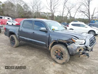 2021 Toyota Tacoma SR z VIN 5TFCZ5AN0MX257568, wystawiony jako IAAI lot #41464773 z przebiegiem 126 441 mil mil oraz . Historia ofert i sprzedaży dostępna na DreamBid. Obrazek 1.