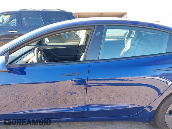 2022 Tesla Model 3 Long Range with VIN 5YJ3E1EB1NF257059, listed as a IAAI auction lot 41329318 with 30,652 mi miles and . Bid and sale history available at DreamBid. Image 14.