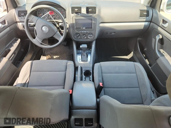 2009 Volkswagen Rabbit S with VIN WVWDB71K79W120196, listed as a Copart auction lot 62126625 with 105,695 mi miles and Salvage title. Bid and sale history available at DreamBid. Image 8.