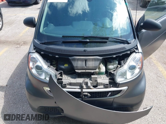 2013 Smart fortwo Pure with VIN WMEEJ3BA9DK585327, listed as a IAAI auction lot 42343616 with 101,194 mi miles and . Bid and sale history available at DreamBid. Image 10.