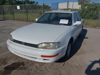 1993 Toyota Camry LE with VIN 4T1SK12E6PU316163, listed as a IAAI auction lot 42046444 with 261,514 mi miles. Bid and sale history available at carsss.com. Image 2.