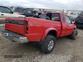 1999 Nissan Frontier XE with VIN 1N6ED26Y4XC313142, listed as a Copart auction lot 85777354 with 122,822 mi miles and Salvage title. Bid and sale history available at DreamBid. Image 3.