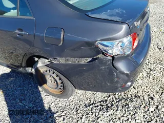 2010 Toyota Corolla with VIN 2T1BU4EE3AC316203, listed as a IAAI auction lot 35972106 with 198,544 mi miles. Bid and sale history available at carsss.com. Image 6.