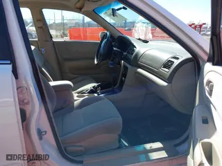 1998 Mazda 626 DX with VIN 1YVGF22CXW5702980, listed as a IAAI auction lot 41778063 with 104,672 mi miles. Bid and sale history available at carsss.com. Image 5.