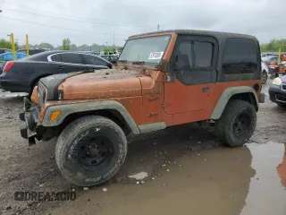 2001 Jeep Wrangler Sport z VIN 1J4FA49S71P310197, wystawiony jako Copart lot #57970395 z przebiegiem 115 755 mil mil oraz Czysty tytuł • Clean title. Historia ofert i sprzedaży dostępna na DreamBid. Obrazek 1.