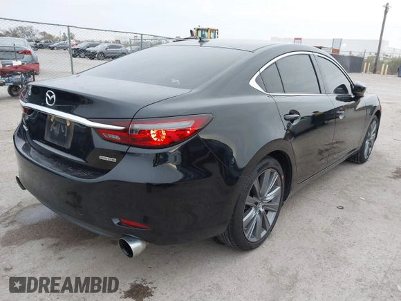 2020 Mazda 6 Grand Touring with VIN JM1GL1TY5L1513949, listed as a IAAI auction lot 40953540 with 55,616 mi miles and . Bid and sale history available at DreamBid. Image 4.