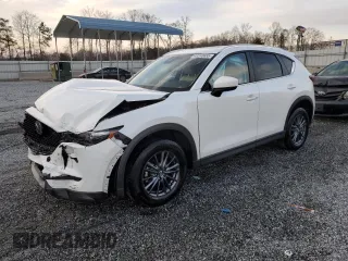 2020 Mazda CX-5 Touring with VIN JM3KFACM0L0863937, listed as a Copart auction lot 48240655 with 70,592 mi miles and Salvage Title. Bid and sale history available at carsss.com. Image 1.