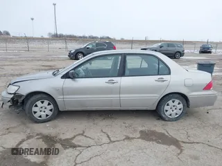 2002 Mitsubishi Lancer ES with VIN JA3AJ26E62U043039, listed as a IAAI auction lot 41600217 with 141,217 mi miles. Bid and sale history available at carsss.com. Image 14.