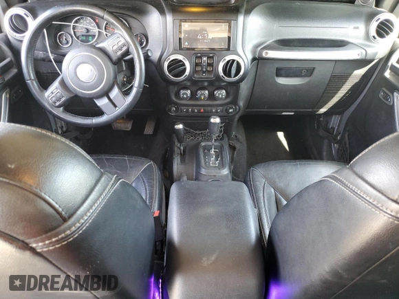 2014 Jeep Wrangler Unlimited Sahara with VIN 1C4HJWEG1EL126611, listed as a Copart auction lot 57169485 with 122,000 mi miles and Salvage title. Bid and sale history available at DreamBid. Image 8.